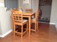 Table and 4 chairs. Table extends to seat six. Excellent condition